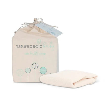 Naturepedic organic cotton baby blanket with packaging on a white background