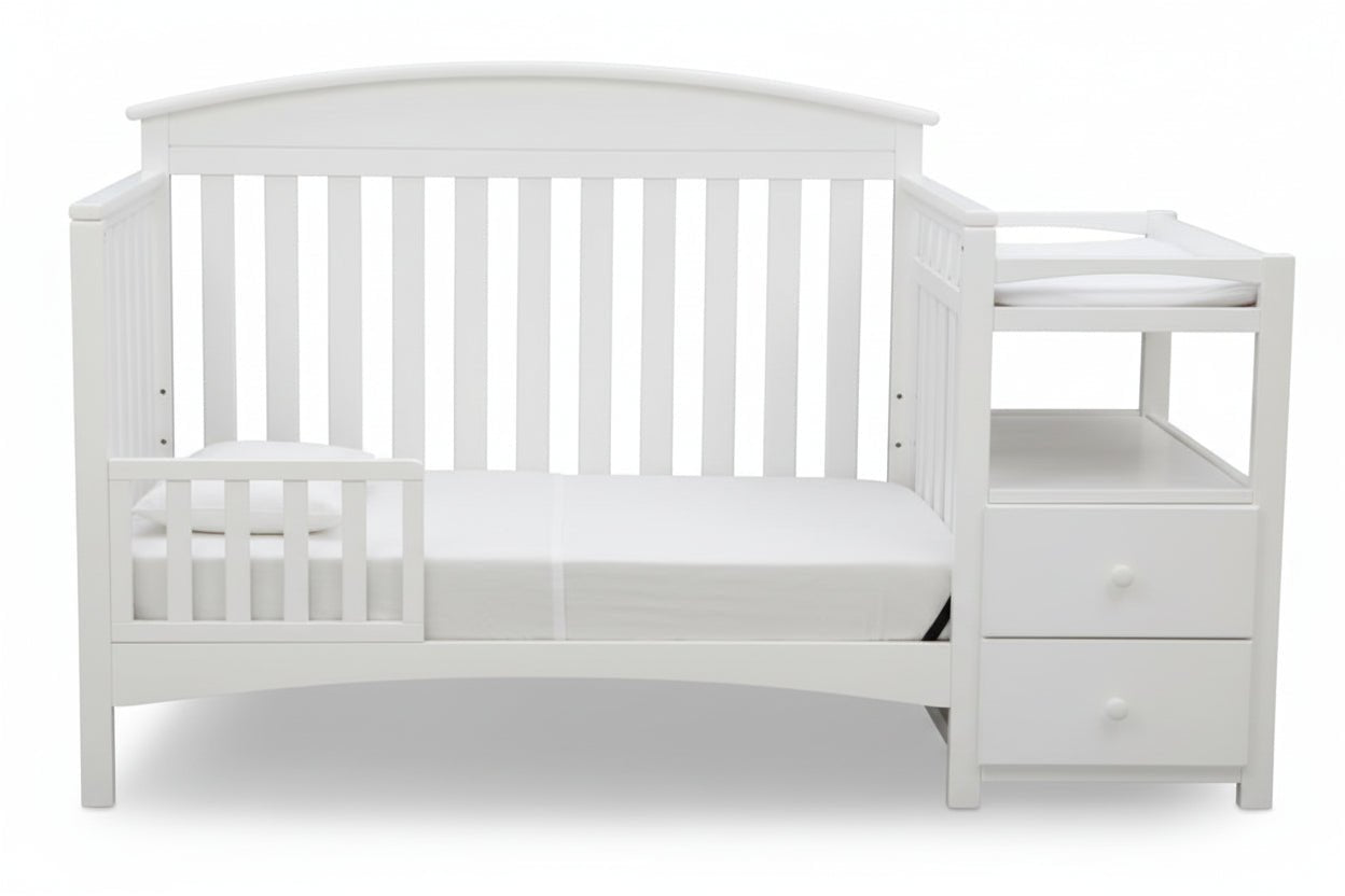 Gray crib with changing table on a white background