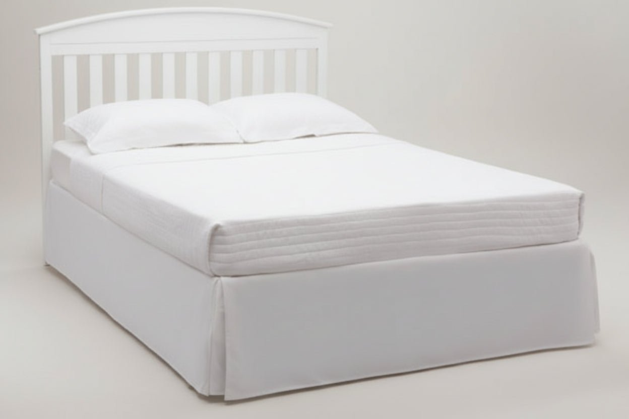 Gray bed frame with white mattress on a white background