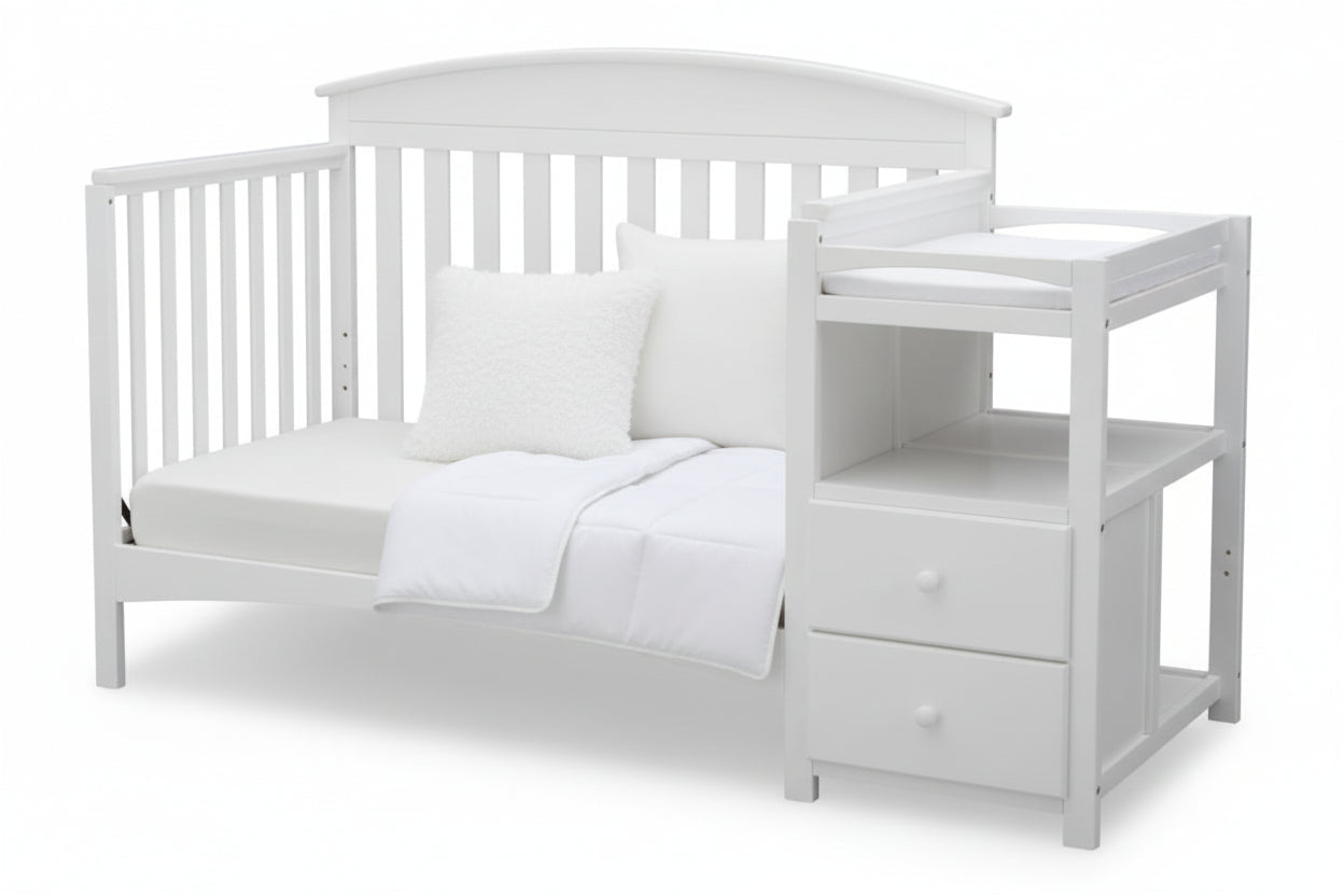 Gray crib with a changing table on a white background
