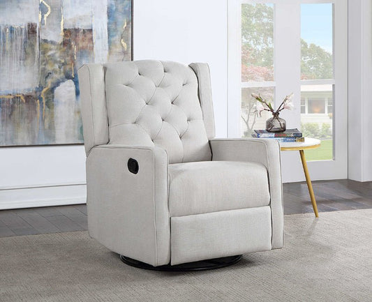 A light beige upholstered recliner chair with button tufting on the backrest, shown in a bright modern room with a side table and large windows.