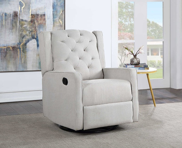A light beige upholstered recliner chair with button tufting on the backrest, shown in a bright modern room with a side table and large windows.