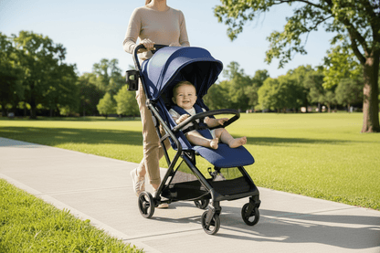 Woman pushing a blue stroller with a baby in a park