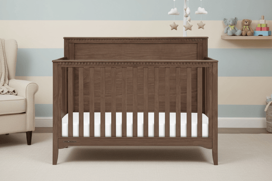 Wooden crib with a white mattress on a white background
