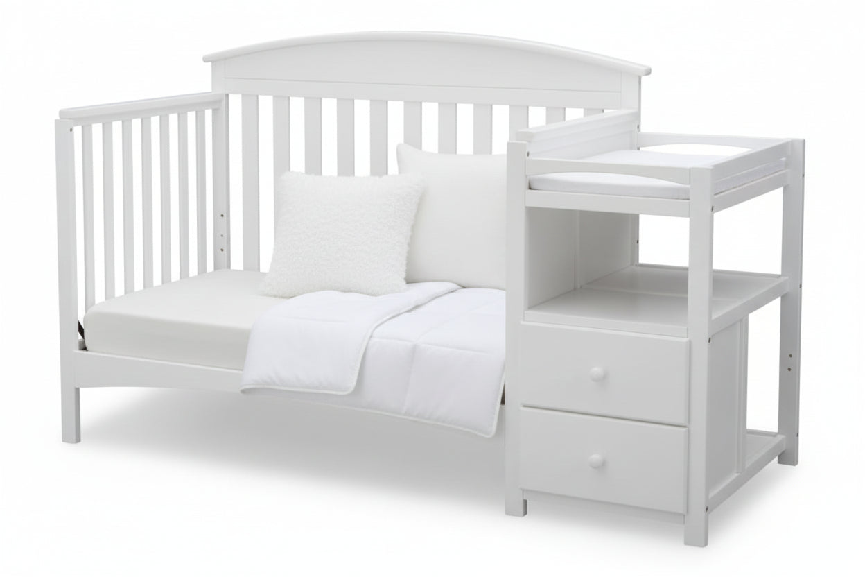 Gray crib with a changing table on a white background