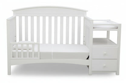 Gray crib with changing table on a white background