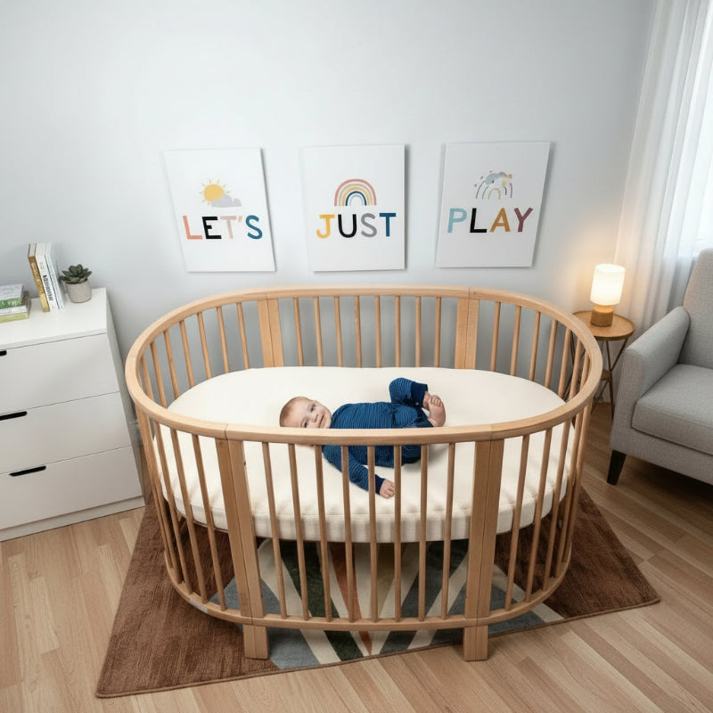 Breathable organic oval crib mattress designed to fit Stokke Sleepi crib for safer baby sleep