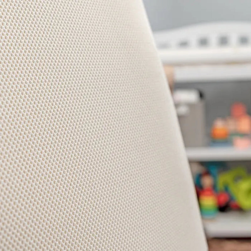 Breathable organic oval crib mattress designed to fit Stokke Sleepi crib for safer baby sleep