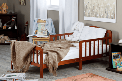 Wooden crib with blankets in a room setting