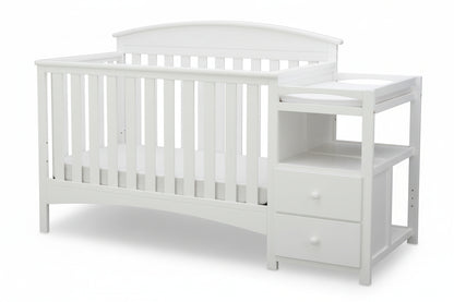 Gray crib with changing table on a white background